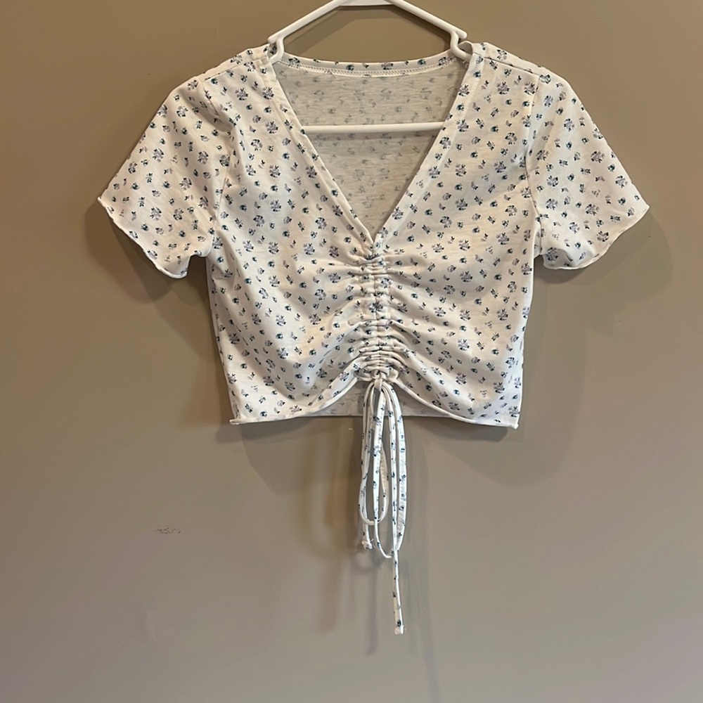 White and floral top with adjustable tie